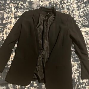 A black women’s suit jacket.